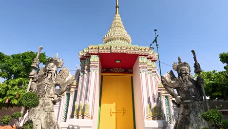 statue and temple entrance in bangkok, thailand