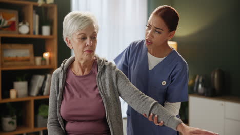 senior woman receiving physical therapy at home