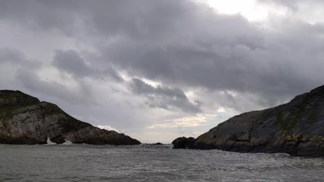 dramatic cloudscape over mumbles near lighthouse in swansea uk with choppy waves 4k