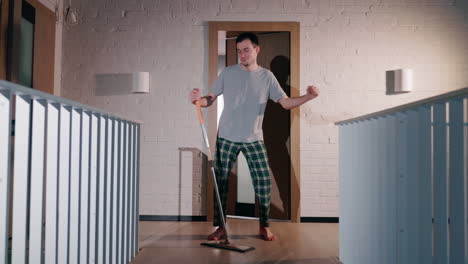 man dancing while mopping