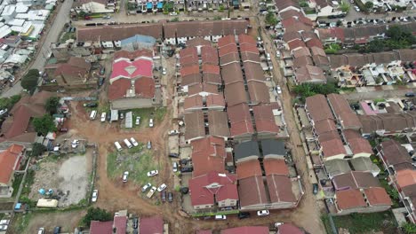 Aerial-view,-modern-buildings-by-poor-housing-area,-Kibera-slum,-Nairobi,-Kenya