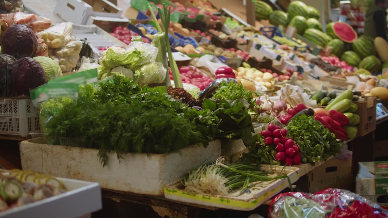 Vibrant Display of Fresh Vegetables and Fruits at a Market Stall