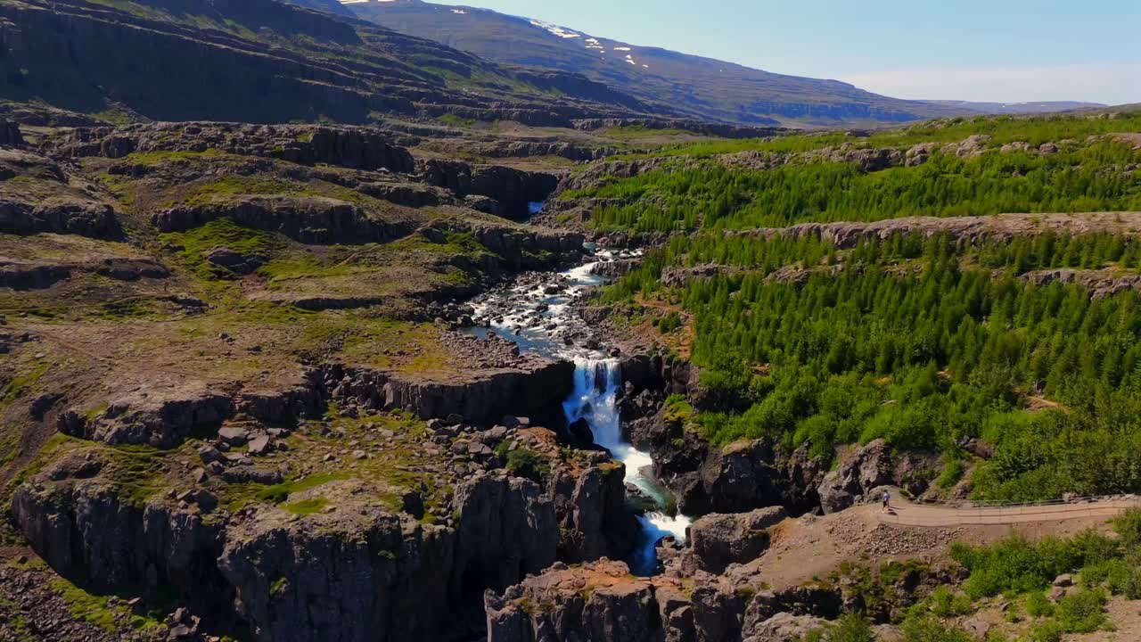 Discover the stunning landscapes of Egilsstaðir through breathtaking drone footage, showcasing lush valleys and serene lakes nestled in Iceland’s East Fjords.