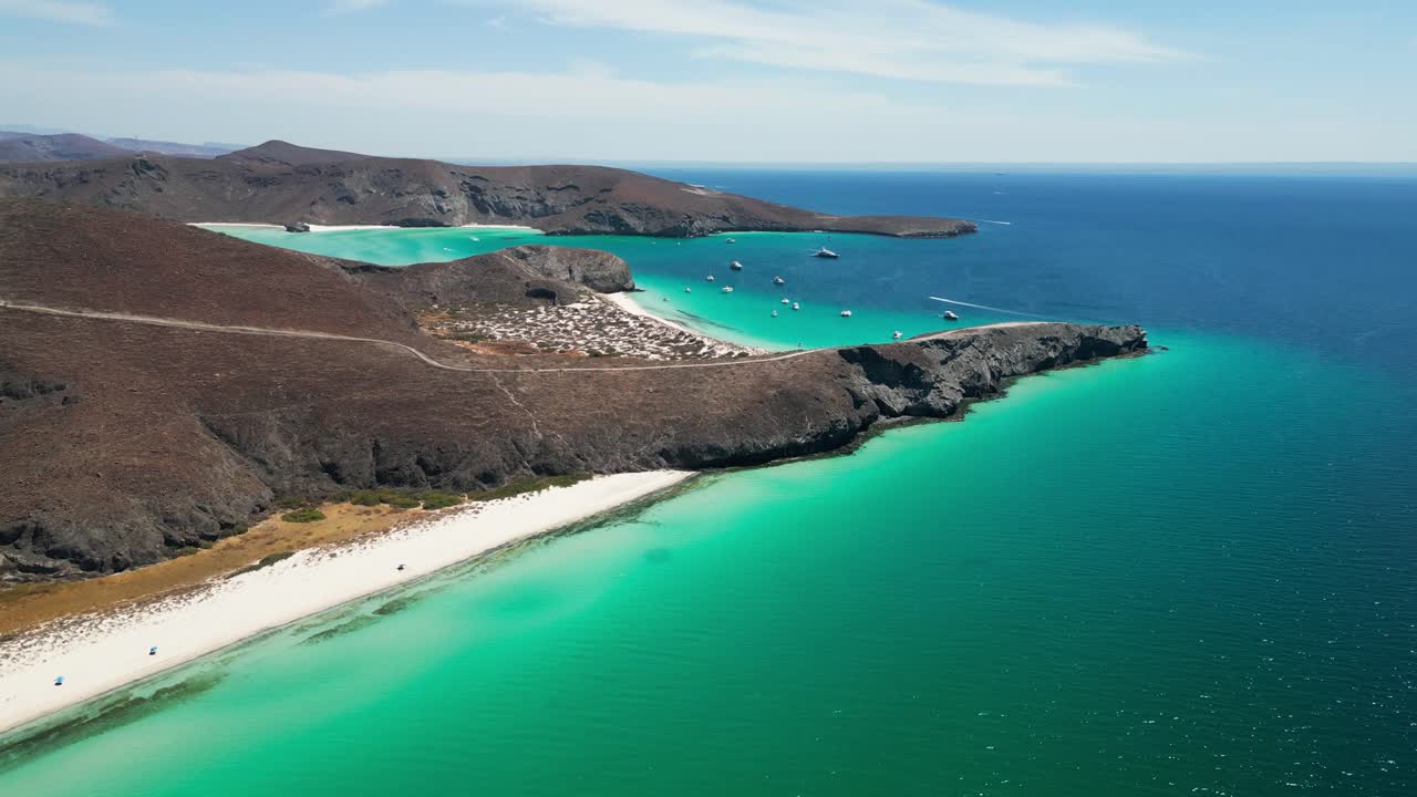 Turquoise waters surrounding sandy beaches and rocky hills in La Paz, Mexico