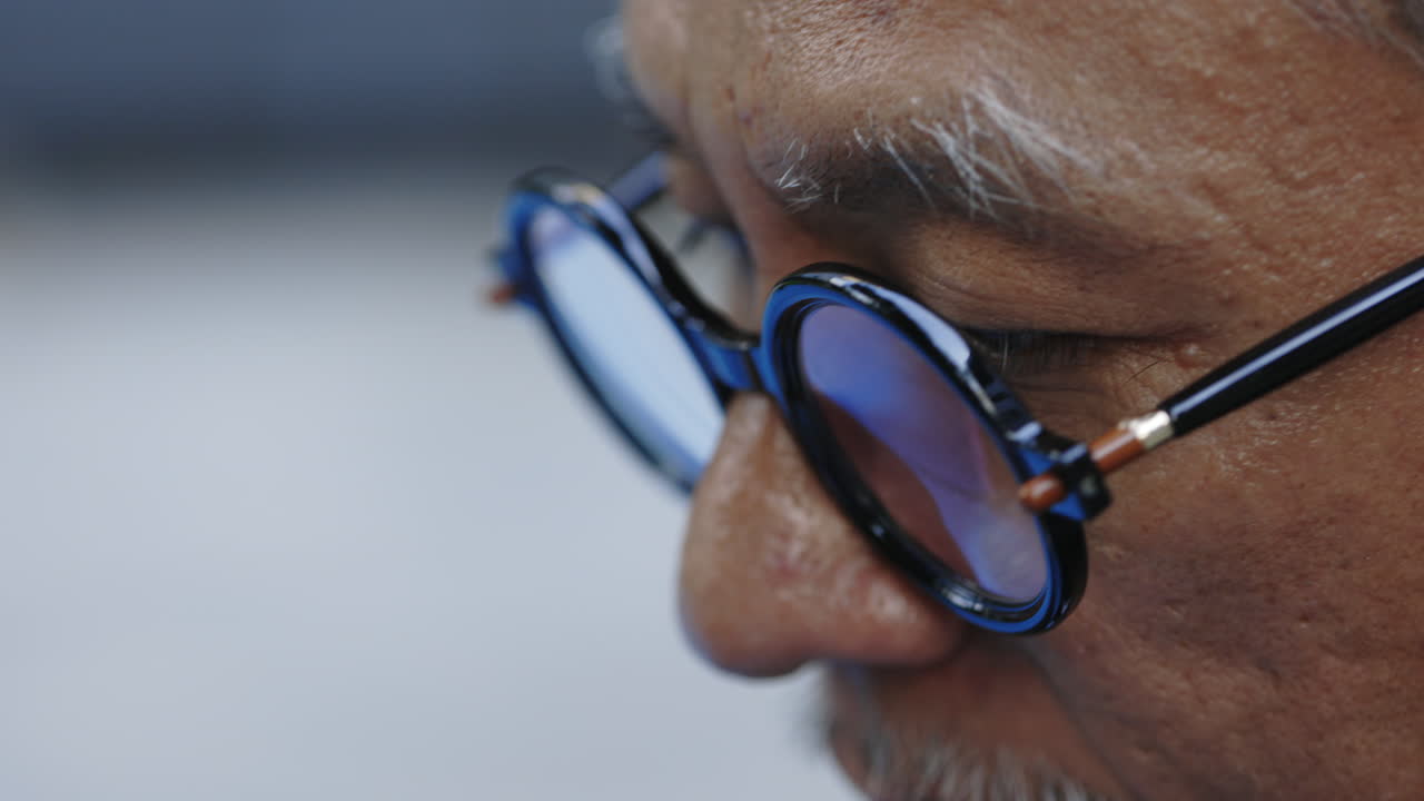 Close up of a man with eyeglasses