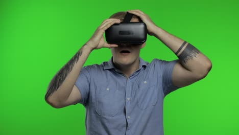 man using vr headset helmet to play game. watching virtual reality 3d 360 video. chroma key