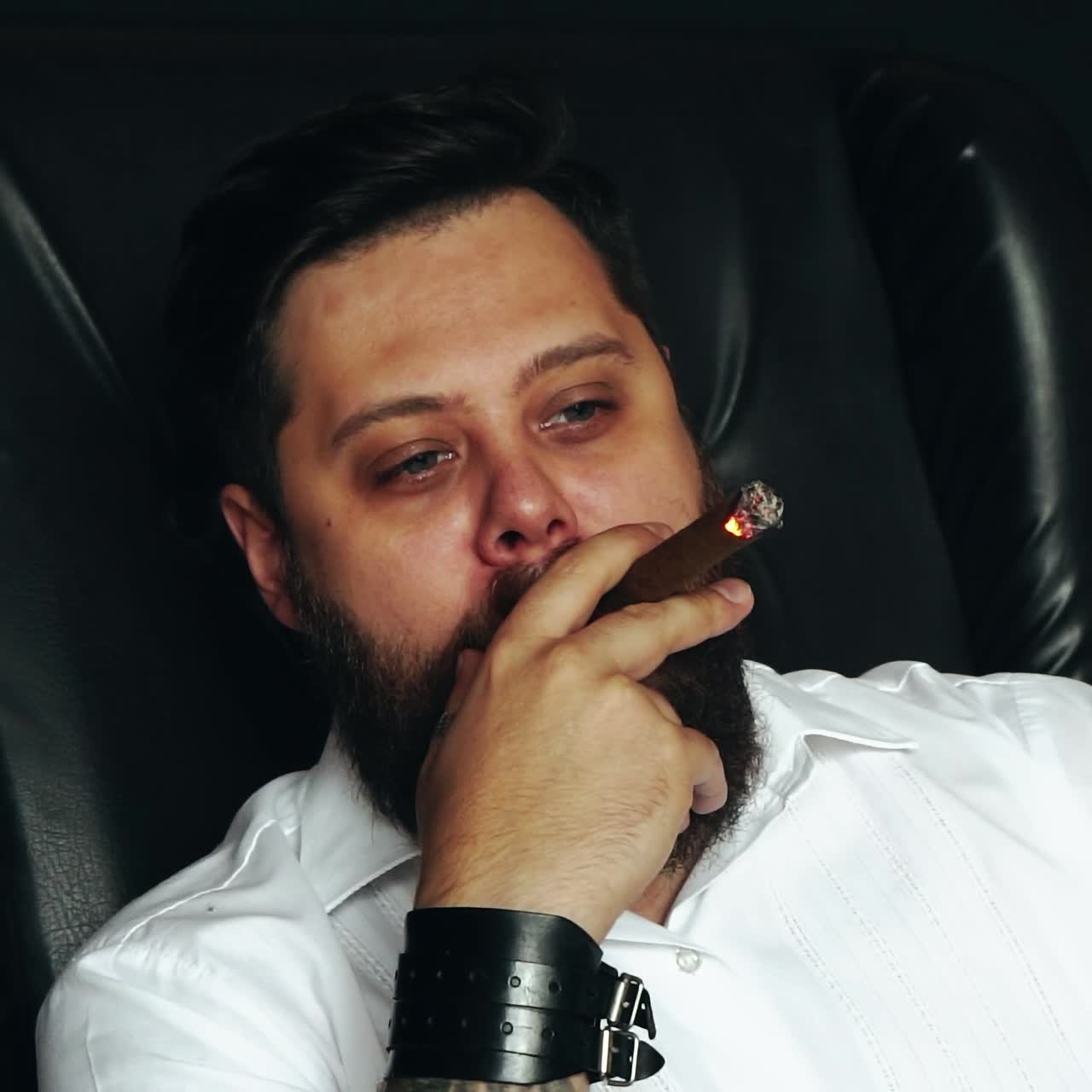 Brutal man smoking cigar