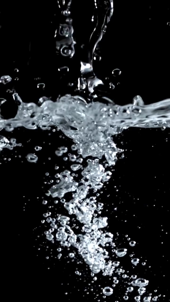 Clear Water Splashing and Bubbling on Black Background