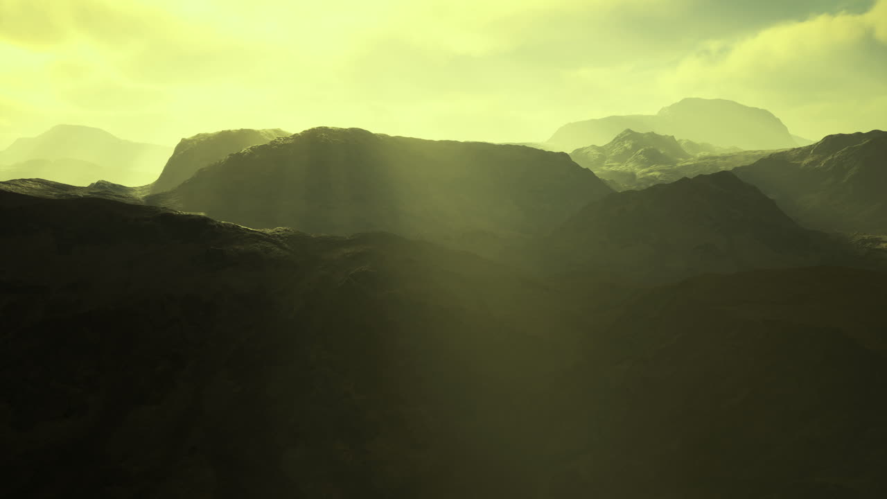 Majestic mountain landscape bathed in golden sunlight at dawn