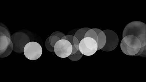 las luces de bokeh de bucle de 4k se superponen, las partículas de bokeh elegantes y deliciosas, los fondos de bucle negro