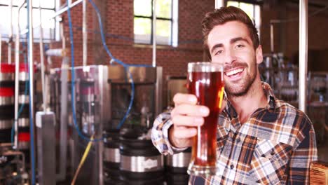 brewery worker checking the product