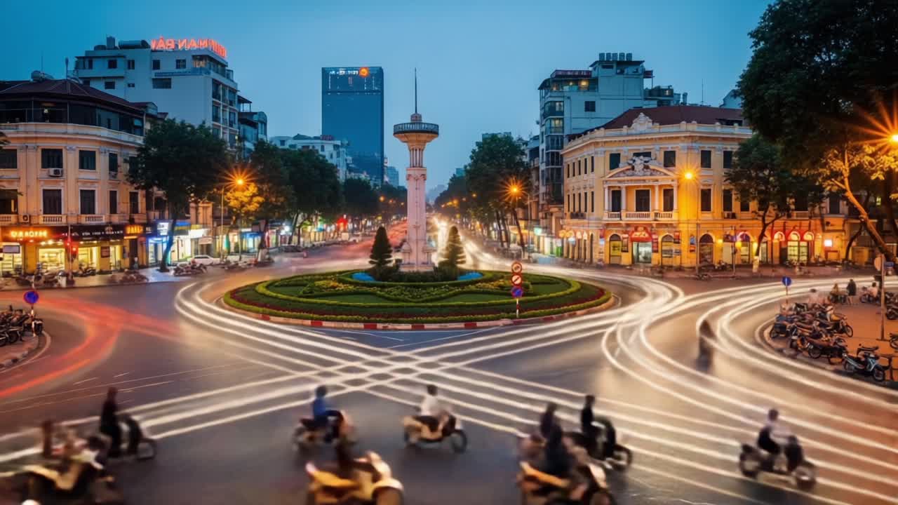 A Captivating Urban Landscape at Dusk: A Vibrant Intersection Buzzing with Life, Highlighting Traffic Patterns and City Lights Against a Night Sky