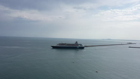 sideway aerial view of a cruise ship in mediterranean sea cloudy day sete depart
