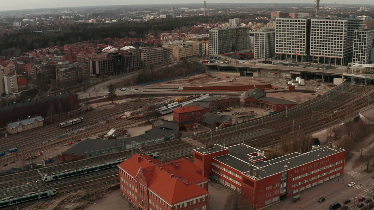 Train leaving Pasila station in Helsinki aerial