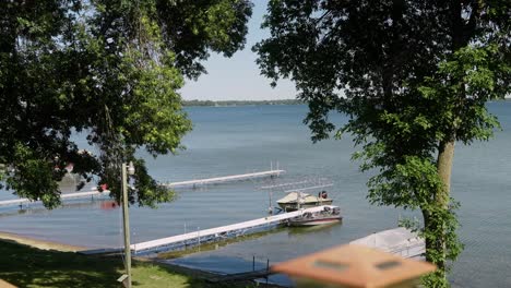 docks in a lake with boats in the middle of summer in northern minnesota