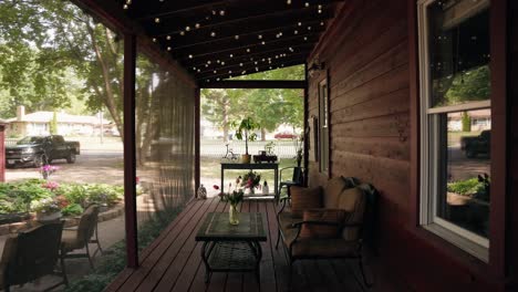 close-up of a screened-in patio on a sunny summer day, showing a comfortable couch and coffee table