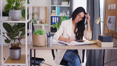 Enterprising-Businesswoman-Working-on-Company-Strategy-in-Office