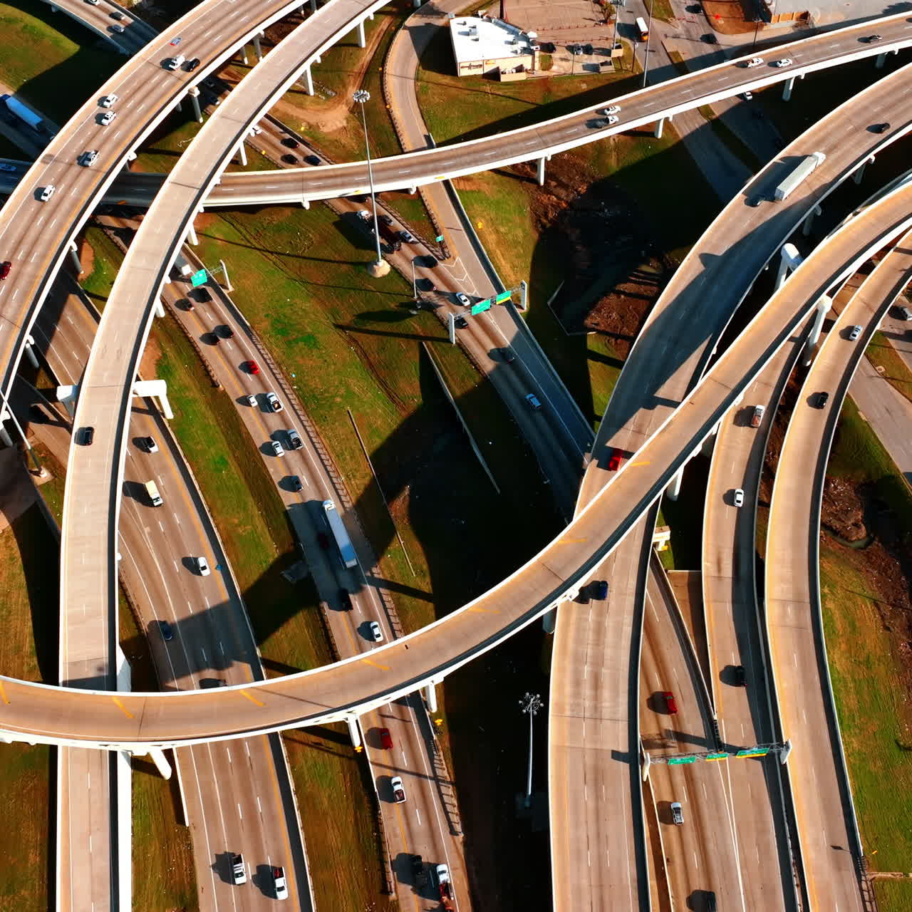 Lots of highways and freeways with cars running by them. Top view on the traffic system in Dallas, Texas, USA