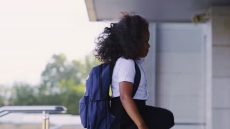 schoolgirl walking down stairs