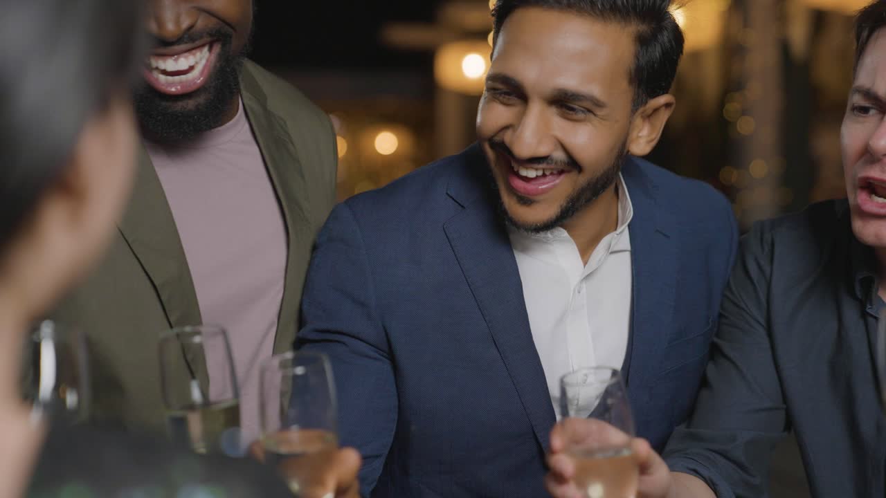 Tracking Shot Following a Woman Joining Her Friends at a Bar