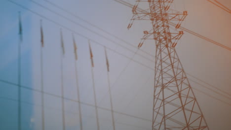 looking at transmission tower from moving train
