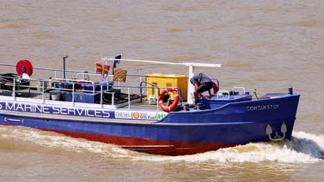 a boat navigating the river in london