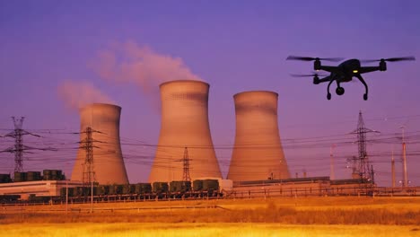 drone flying near an industrial power plant with cooling towers