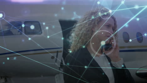 animation of network of connections caucasian businesswoman with smartphone by plane