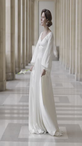 woman in a beautiful white satin wedding dress