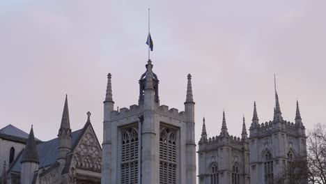 westminster hall and westminster abbey closeup of flags flying at half-mast to mark the death of prince philip, duke of edinburgh, saturday, april 10th, 2021 - london uk