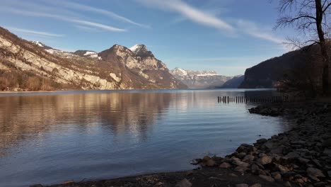 low-altitude drone flight over the stunning walensee lake in the swiss canton of glarus, showcasing its serene waters and breathtaking alpine scenery.