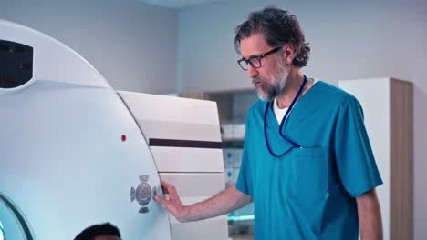 medical professional operating a ct scanner
