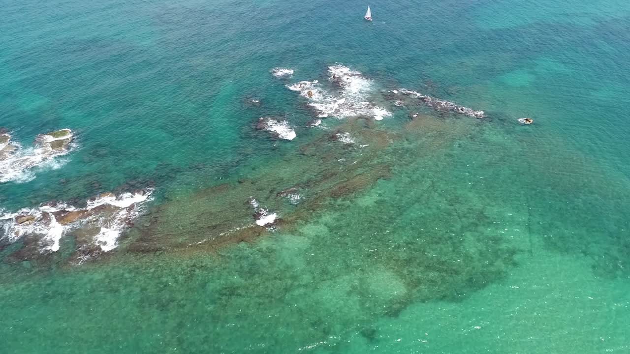 A beautiful blue ocean with Andromeda Rock shoreline, Old Jaffa, Mediterranean Sea.