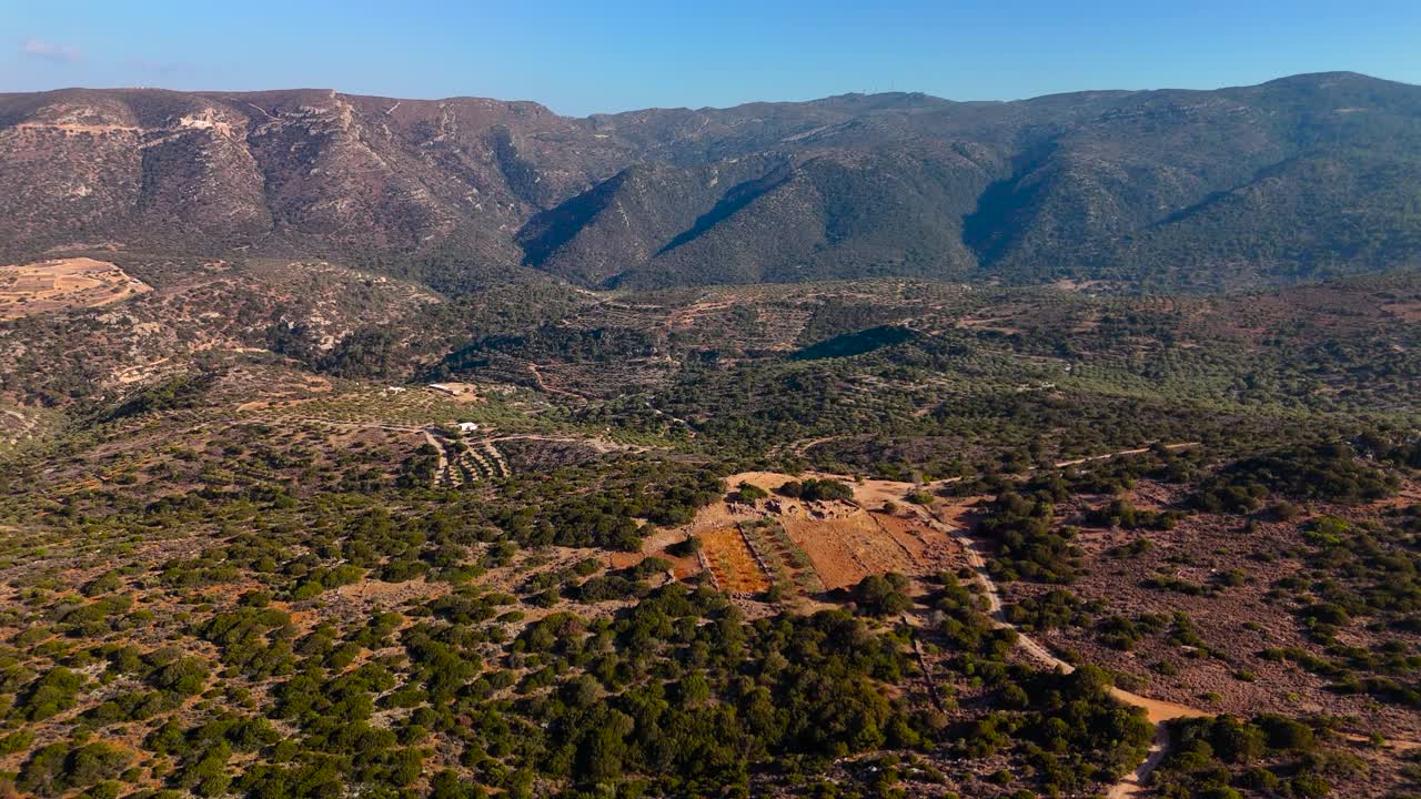 This breathtaking view captures the expansive mountain landscape filled with greenery under a clear blue sky. The serene atmosphere invites exploration and appreciation of nature's wonders