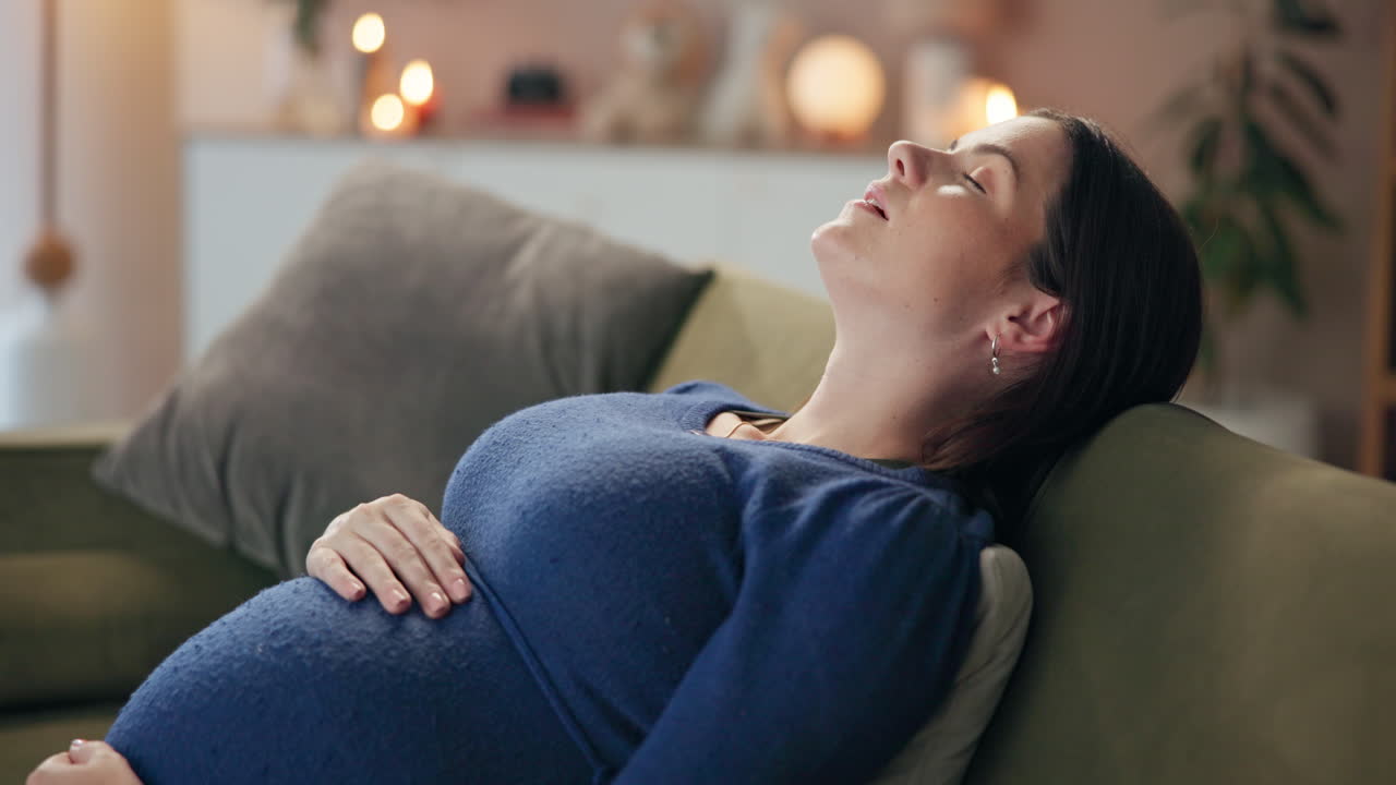 Pregnant woman relaxing on couch