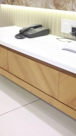 modern wooden table with telephone