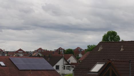 Timelapse-of-storm-clouds-moving-above-a-Balvarian-village-in-afternoon-in-Stuttgart,-Germany,-Europe,-panning-view-angle