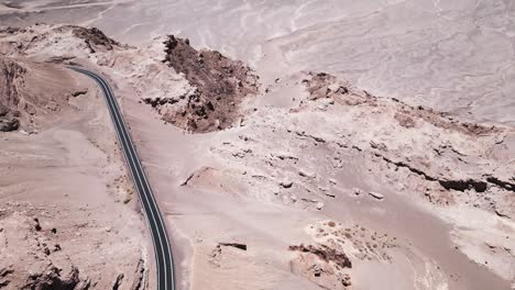 Desert-of-Atacama,-Driest-of-the-World,-Chilean-Andean-Cordillera-Horizon-Aerial-Drone-Above-Road-and-Vast-Open-Plateau-in-South-America