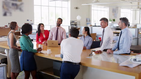 Colleagues-standing-at-a-meeting-in-an-architecture-studio