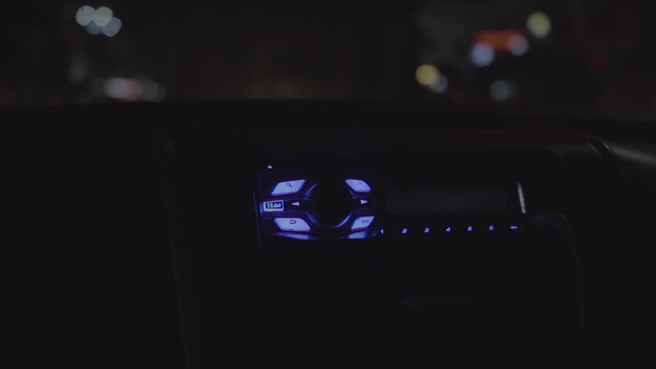 Car radio at night in close up slow motion 4K Hyderabad, India