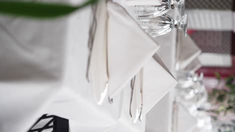 elegant table setting with white napkins and silverware