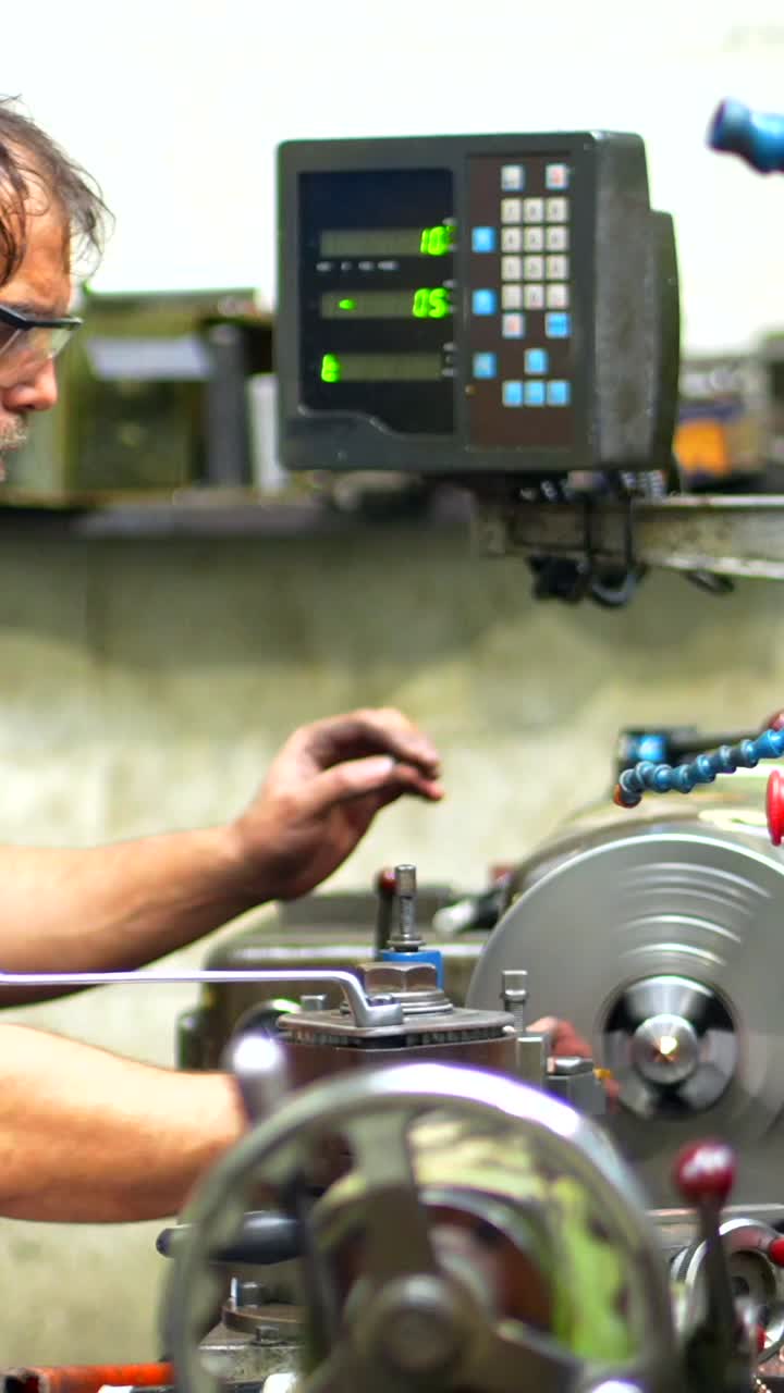 Man operating metalworking machinery