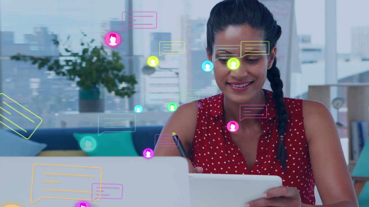 Woman picking stylus and writing on tablet, causing floating chat icons over devices for business