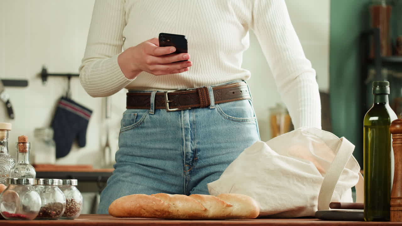 Woman shopping online in kitchen
