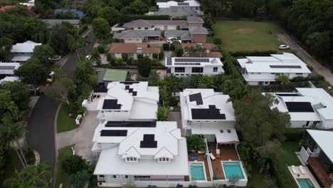 drone shot of luxury homes with swimming pools in byron bay, new south wales, australia