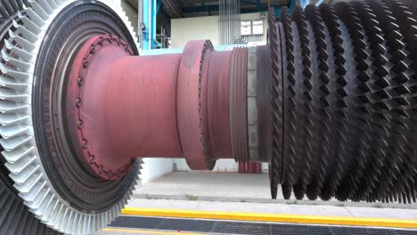 a disassembled turbine rotor and industrial compressor