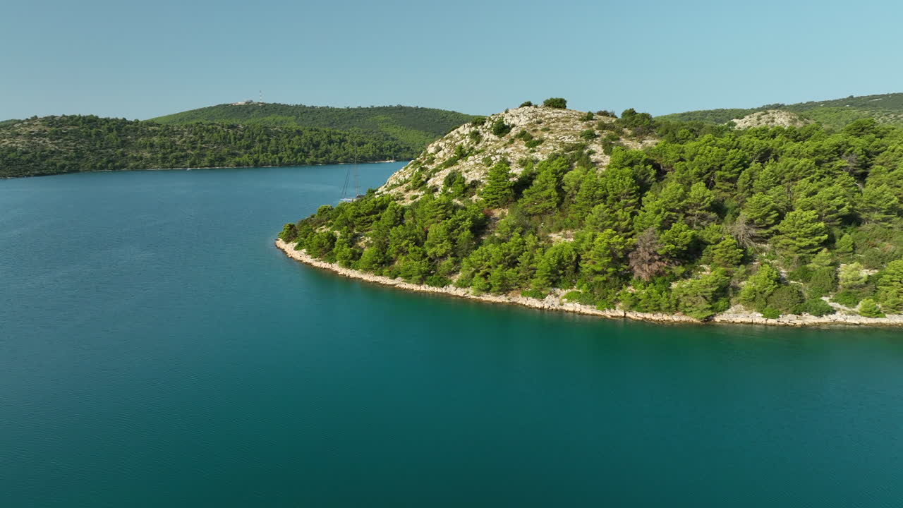 Aerial drone panning shot of Tela&scaron;ćica national park with yachts moored in the bays