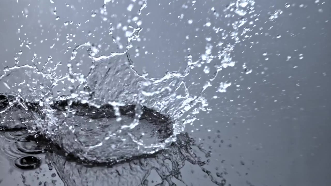 Dynamic Slow Motion Water Splash with Droplets and Ripples