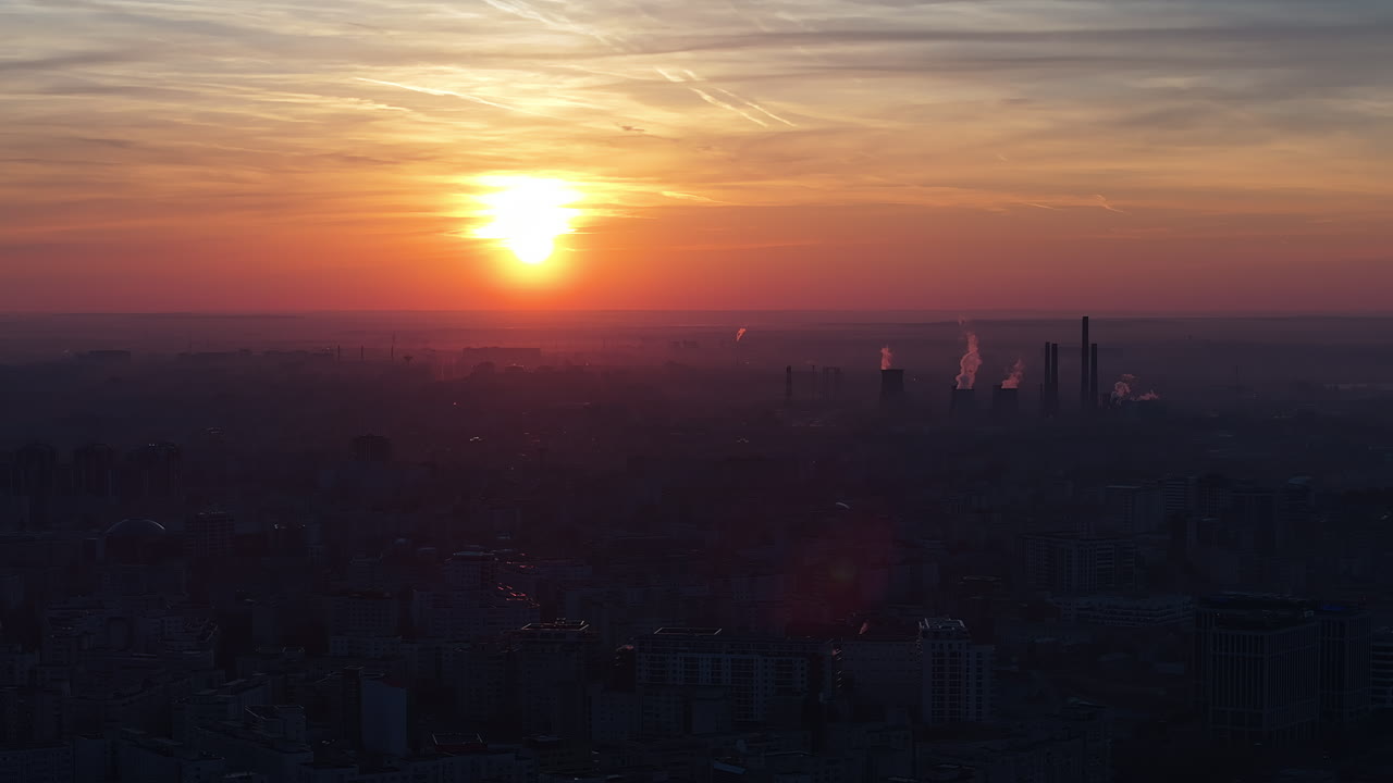 Aerial drone view of thermal power stations in Bucharest at sunset. Cityscape from above. Romania