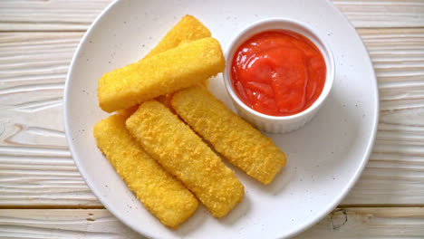 crispy fried fish fingers with ketchup